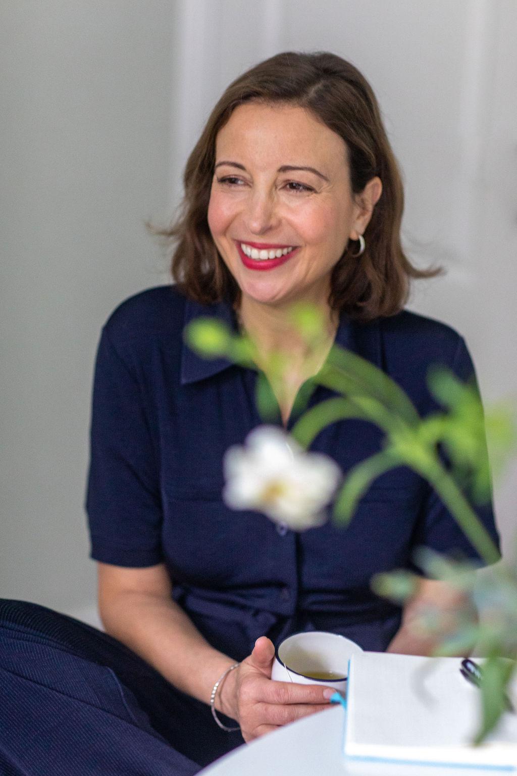 Suzy Glaskie laughing with mug