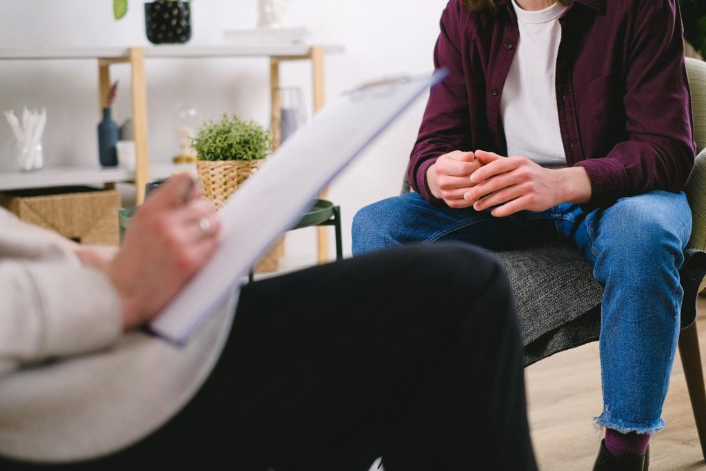 Therapist and client discussing issues in a psychotherapy session, highlighting mental health support.